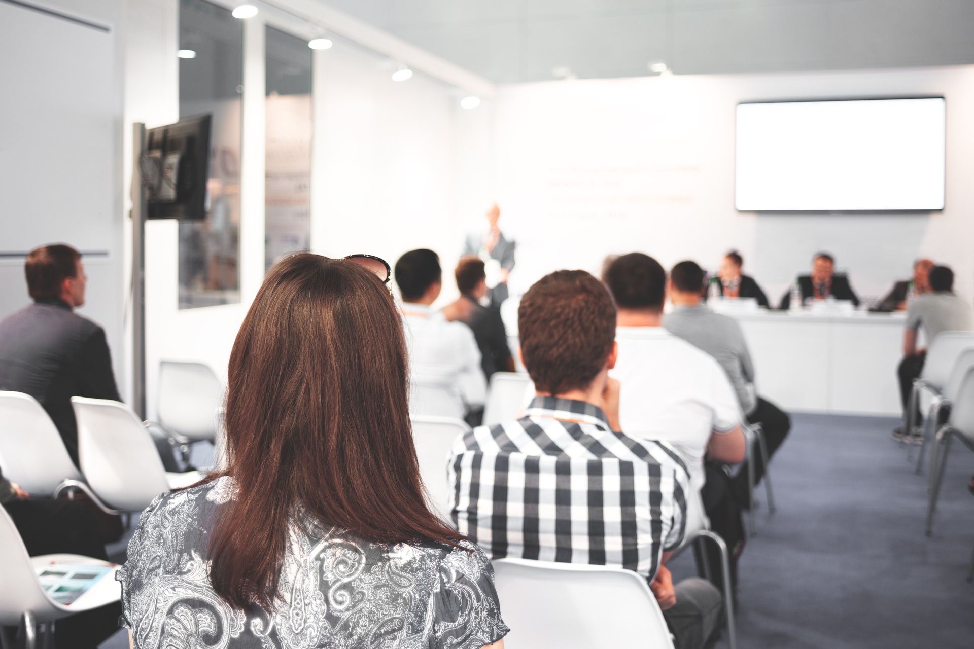 Audience listening to a conference session